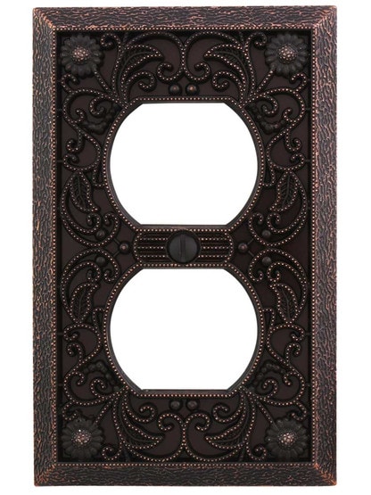 Filigree Single-Duplex Cover Plate in Aged Bronze.